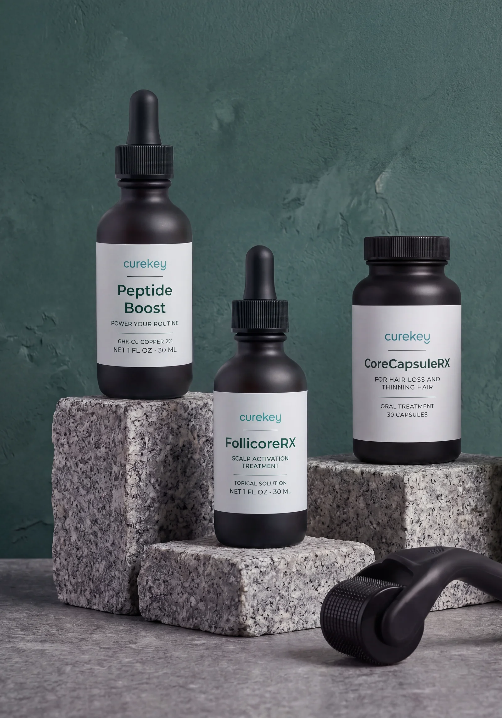 Peptide Boost, FollicoreRX and CoreCapsuleRX with a derma roller on granite blocks